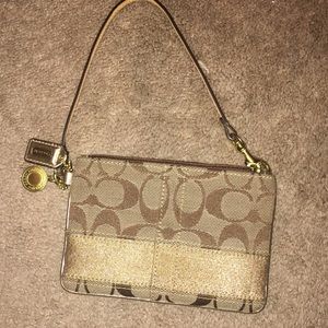Gold coach wristlet